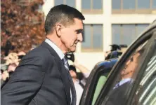  ?? Susan Walsh / Associated Press 2017 ?? The Justice Department has asked that the case against President Trump’s former aide, Michael Flynn, be dismissed.