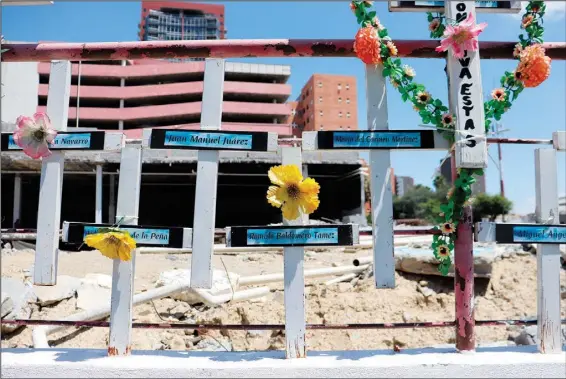  ?? (AP/Marcos Martinez Chacon) ?? In front of the land occupied by the Casino Royale, relatives have installed a memorial to remember the victims of the Aug. 25, 2011, attack on the Casino Royale, in Monterrey, Mexico.