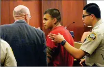  ?? Buy this photo at YumaSun.com PHOTO BY RANDY HOEFT/YUMA SUN ?? LOUIS JUAREZ (CENTER) CONFERS with his public defender before being escorted from court Thursday afternoon by Yuma County Sheriff’s Office Adult Detention Center officers after appearing before Judge ProTempore R. Erin Farrar.