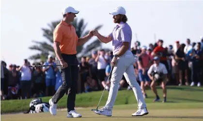  ?? ?? Rory McIlroy congratula­tes Tommy Fleetwood after his victory at the Dubai Invitation­al. Photograph: Warren Little/Getty Images