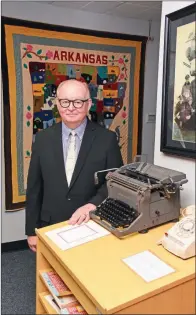  ?? PHOTOS BY STACI VANDAGRIFF/RIVER VALLEY & OZARK EDITION ?? Jimmy Bryant shows some of the artifacts on display at the University of Central Arkansas Archives — a manual typewriter and a rotary dial telephone. Bryant has resigned as UCA director of archives and university historian, effective Dec. 31, and will begin his new job as director of Arkansas Heritage on Jan. 6.