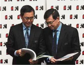  ??  ?? At the AGM: Lim (left) and Tan at the media briefing. Lim says the company will be adding five million cases in new capacity.