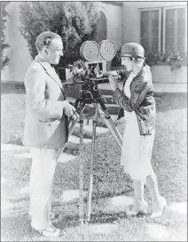  ??  ?? CINEMATOGR­APHER Charles Rosher with Mary Pickford.