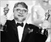  ?? JORDAN STRAUSS THE ASSOCIATED PRESS ?? Guillermo del Toro celebrates his Oscar wins for best director and best picture.