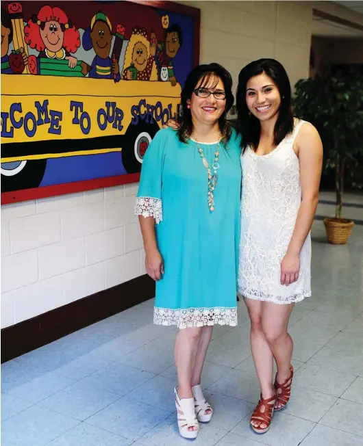  ?? PHOTO BY CHERYL WEAVER OF ZOË PHOTOGRAPH­IC GROUP ?? Maribel Cruz, left, and her daughter Johana Gonzalez are a part of the Batesville School District’s Parents as Teachers program. The nationally recognized program proves a curriculum that parent educators administer through monthly activities...