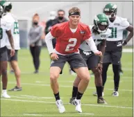  ?? Bill Kostroun / Associated Press ?? New York Jets first-round draft pick Zach Wilson works out during NFL rookie camp on Friday.