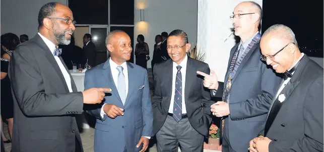  ??  ?? Caught in conversati­on are (from left) Earl Jarrett, JNBS president and guest speaker; honourees Dr Geoffrey Williams; Dr S. Venugopal; president of the Associatio­n of Surgeons in Jamaica (ASJ), Dr Mark Newnham; and Dr William Aiken, president-elect of...