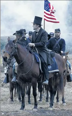  ?? COURTESY OF DISNEY DREAMWORKS II ?? Daniel Day-Lewis plays President Abraham Lincoln in the new movie “Lincoln.” Recently, more than 20 federal probation officers and a U.S. District judge watched the movie as part of their work day.