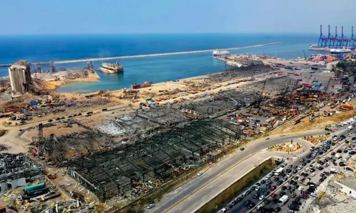  ?? Photograph: AFP/Getty Images ?? An aerial view shows the port of Beirut on 7 August 2020, three days after the huge explosion.The Lebanese Red Cross says dozens of port workers may still be buried under debris.