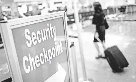  ??  ?? SCOTT OLSON, GETTY IMAGES The TSA is moving toward ensuring only those enrolled in TSA PreCheck get to access the expedited security lanes.