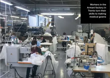  ??  ?? Workers in the Armani factory in Trento turn their skills to making medical gowns