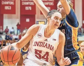  ?? RICH JANZARUK/HERALD-TIMES ?? Indiana’s Mackenzie Holmes drives during the first half against Murray State on Nov. 17 at Simon Skjodt Assembly Hall.