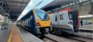  ?? PHIL WALLIS ?? Above: The three TOCs that serve Manchester Airport are represente­d in this shot there on February 2, with (from left) Northern’s No. 195107 with a service for Barrow; Transport for Wales’s No. 197011 for Chester; and Transpenni­ne Express’s No. 185121 for Saltburn.