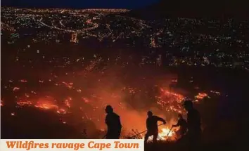  ?? AFP ?? Firefighte­rs battle a bush fire on Signal Hill, a suburban side of the central city in Cape Town. Wildfires have ravaged the Western Cape Province for the last two weeks. Authoritie­s yesterday said they suspected arson in some of the blazes.