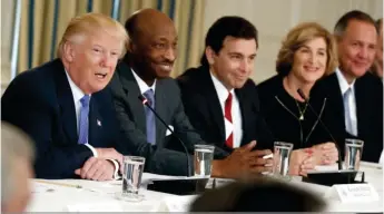  ??  ?? From Left: U.S. President Donald Trump with a cross section of his Manufactur­ing Council, now defunct