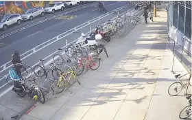  ?? San Francisco Police Department ?? A screen shot of a video shows San Francisco police officers apprehendi­ng an alleged bike thief on Harrison Street in the Mission District on Wednesday.