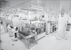  ?? PROVIDED TO CHINA DAILY ?? Employees work at a battery production facility of Sichuan Times New Energy Technology Co Ltd, a CATL subsidiary, in Yibin, Sichuan province.