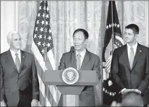  ?? AP/ ALEX BRANDON ?? Terry Gou, president and chief executive officer of Foxconn, accompanie­d by Vice President Mike Pence ( left) and House Speaker Paul Ryan, R- Wisconsin, speaks in the East Room of the White House on July 26.