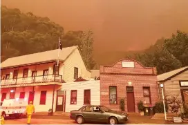  ??  ?? Left: There was an eerie glow as fire threatened the historic gold mining town of Walhalla in February. Two separate downpours of 5mm and 10mm helped firefighti­ng efforts to save the town.