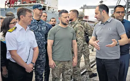  ?? ?? President Volodymyr Zelensky and his minister of infrastruc­ture Oleksandr Kubrakov visit a sea port yesterday before restarting grain exports, in the wake of Russia’s attack on Odesa