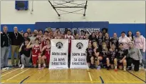  ?? PHOTO COURTESY MH CATHOLIC BOARD OF EDUCATION FACEBOOK ?? The Monsignor McCoy Colts senior boys and girls basketball teams pose with their 3A South zone championsh­ip banners after winning zones this weekend at Crescent Heights High School.