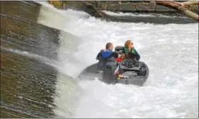  ?? PHOTOS BY BARRY TAGLIEBER — FOR DIGITAL FIRST MEDIA ?? A family of four were stranded Thursday below the Schulkill River’s Black Rock Dam by the dangerous circular currents common at the bottom of low-head dams.