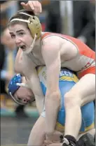  ?? TIM COOK/THE DAY ?? St. Bernard/Norwich Tech’s Matt Dowler, top, beat Ellis Tech’s Baltazar Gonzalez 10-6 to win the Class M 106-pound title Saturday night.