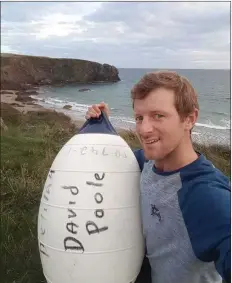  ??  ?? Graham Doyle with the buoy.
