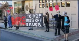  ?? Shelly Thorene / Union Democrat ?? Protestors against the legalizati­on of recreation­al marijuana stand in front of City Hall on Monday.