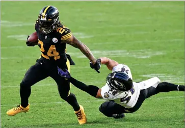  ?? AP PHOTO BY DON WRIGHT ?? Pittsburgh Steelers running back Benny Snell (24) runs away from Baltimore Ravens outside linebacker L.J. Fort (58) during the first half of an NFL football game, Wednesday, Dec. 2, in Pittsburgh.