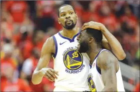  ?? AP/DAVID J. PHILLIP ?? Warriors forward Kevin Durant (35) celebrates with teammate Draymond Green (23) on Monday in Houston.