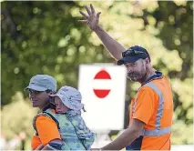  ??  ?? Mark, Ngahuia and Willem walk away after they joined other families and workers employed by Lyttelton Port Company.