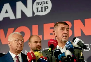  ?? PHOTO: REUTERS ?? The leader of ANO party Andrej Babis, right, speaks during a news conference at the party’s election headquarte­rs after the country’s parliament­ary elections in Prague, Czech Republic.