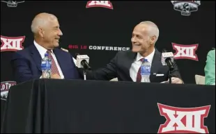  ?? Associated Press ?? Incoming Big 12 Commission­er Brett Yormark, right, shares a laugh with outgoing Commission­er Bob Bowlsby at a news conference opening the NCAA college football Big 12 media days in Arlington, Texas on Wednesday.