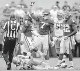  ??  ?? OU defensive end Ronnie Perkins celebrates a sack against UCLA last Saturday. [PHOTO BY BRYAN TERRY, THE OKLAHOMAN]