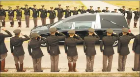  ?? Smiley N. Pool / TNS ?? The hearse carrying former first lady Barbara Bush passes through members of the Texas A&M Corps of Cadets as it nears her husband's presidenti­al library at the university on Saturday in College Station, Texas. After an invitation-only funeral in...