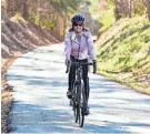  ?? GREENVILLE NEWS FILE PHOTO ?? A cyclist rides her bicycle down the Swamp Rabbit Trail in Greenville.