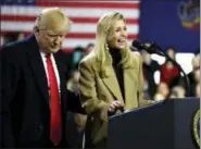  ?? EVAN VUCCI — THE ASSOCIATED PRESS ?? President Donald Trump brings his daughter Ivanka Trump to the stage as he speaks at H&K Equipment Company during a visit to promote his tax and economic plan Thursday in Coraopolis, Pa.