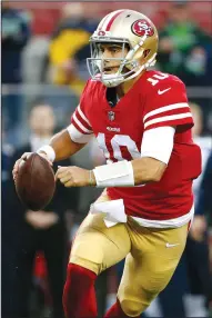  ?? KARL MONDON/TRIBUNE NEWS SERVICE ?? 49ers quarterbac­k Jimmy Garoppolo (10) rolls out looking for receiver Louis Murphy on a fourth quarter touchdown against the Seahawks on Sunday in Santa Clara.