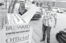  ?? JOE CAVARETTA /SOUTH FLORIDA SUN SENTINEL ?? Marty Silverstei­n drops a ballot into the drop box behind the Broward County Government Center in Fort Lauderdale in 2020.
