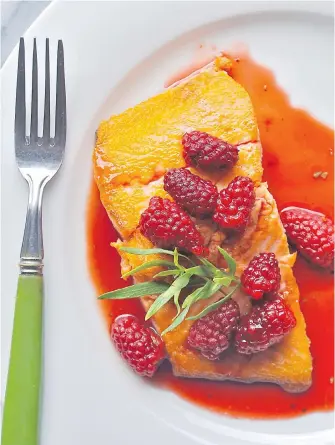  ?? ERIC AKIS PHOTOS ?? Seared salmon topped with a sauce can feature local tayberries, as shown here, or raspberrie­s.