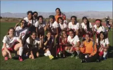  ??  ?? The Imperial High girls' soccer team smiles for a photo after taking first place in the Desert Mirage Soccer Tournament on Saturday. PHOTO COURTESY OF LUIS SOTELO