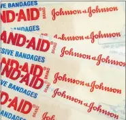  ?? (AP PHOTO/WILFREDO LEE, FILE) ?? This Sept. 13, 2016, file photo, shows Johnson & Johnson Band-Aid brand bandages in Surfside, Fla. Higher prescripti­on drug sales and lower costs for litigation drove up Johnson & Johnson’s fourth-quarter profit by 32%. The world’s biggest maker of health care products on Wednesday, July 15, 2020, reported net income rose nearly $1 billion, to $4.01 billion, or $1.50 per share.