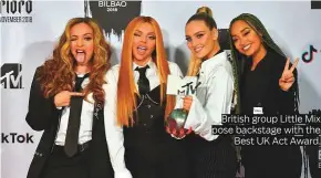  ??  ?? British group Little Mix pose backstage with the Best UK Act Award.