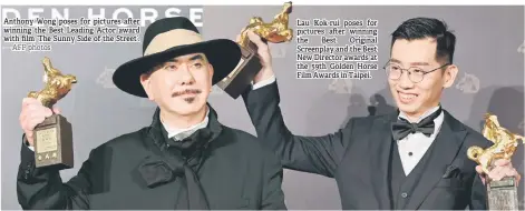  ?? — AFP photos ?? Anthony Wong poses for pictures after winning the Best Leading Actor award with film ‘The Sunny Side of the Street’.
Lau Kok-rui poses for pictures after winning the Best Original Screenplay and the Best New Director awards at the 59th Golden Horse Film Awards in Taipei.