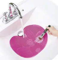  ??  ?? Photo from www.shefinds.com The Sigma Spa Brush Cleaning Mat is a beauty tool that allows you to clean your makeup brushes efficientl­y and quickly. It features seven textures to wash both face and eye brushes. The mat also comes with suction cups so you can secure it on your sink. Available at Pure Beauty in Serendra, Fort.