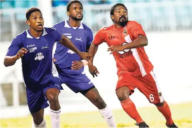  ?? RICARDO MAKYN ?? Keith Kelly (right) in action for Greenbay Hoppers in the Antigua and Barbuda Football associatio­n Premier League match at the Antigua Recreation Ground on Sunday, February 25.