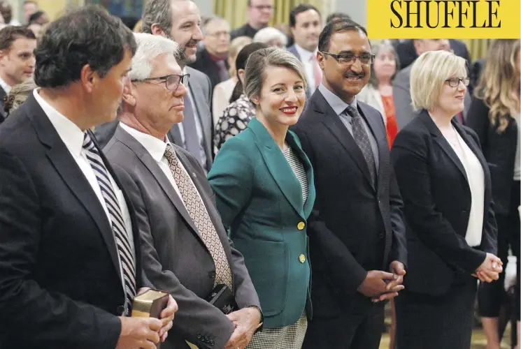  ?? PATRICK DOYLE/THE CANADIAN PRESS ?? Dominic LeBlanc, from left, Jim Carr, Mélanie Joly, Amarjeet Sohi and Carla Qualtrough attend a swearing-in ceremony at Rideau Hall in Ottawa on Wednesday.