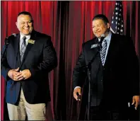  ?? Arkansas Democrat-Gazette/THOMAS METTHE ?? Pulaski County sheriff’s candidates Carl Minden (left) and Eric Higgins laugh after confusion over who would answer a question first during the Pulaski County Democratic candidate debate on Sunday at South on Main in Little Rock.