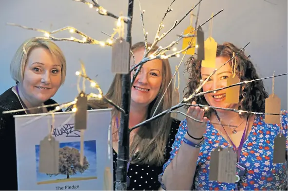  ?? ?? Susie Clark, Jody Docherty and Maxine Linton with the pledge tree at the launch event at Webster Memorial Theatre in Arbroath.